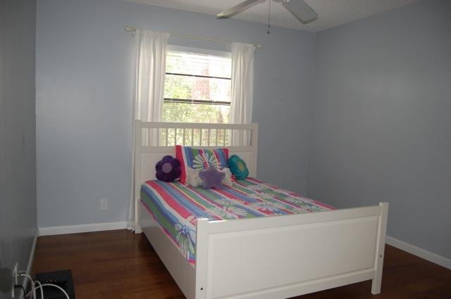 2899 Northwest 24th Court Boca Raton, FL 33431 - Photo 18 of 31 a bed sitting in a bedroom next to a window