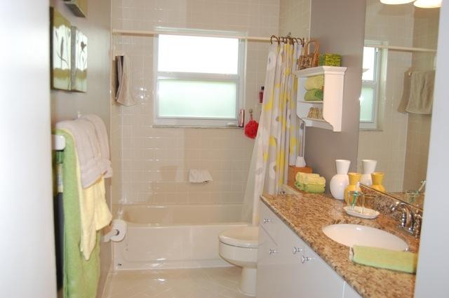 2899 Northwest 24th Court Boca Raton, FL 33431 - Photo 19 of 31 a bathroom with a granite countertop sink toilet and shower