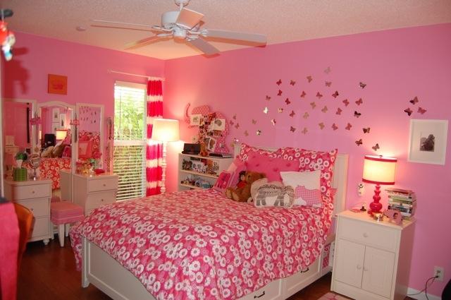 2899 Northwest 24th Court Boca Raton, FL 33431 - Photo 20 of 31 a bedroom with a bed and a chandelier