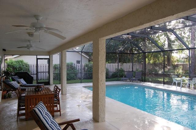 2899 Northwest 24th Court Boca Raton, FL 33431 - Photo 21 of 31 a view of a swimming pool with a patio