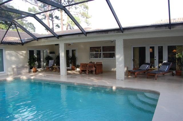 2899 Northwest 24th Court Boca Raton, FL 33431 - Photo 22 of 31 a swimming pool with outdoor seating and yard