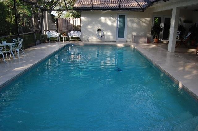 2899 Northwest 24th Court Boca Raton, FL 33431 - Photo 24 of 31 a view of a swimming pool with outdoor seating