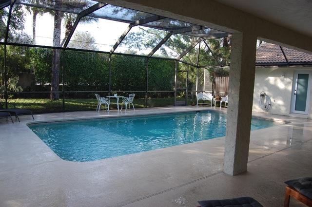 2899 Northwest 24th Court Boca Raton, FL 33431 - Photo 25 of 31 a view of a swimming pool with a patio