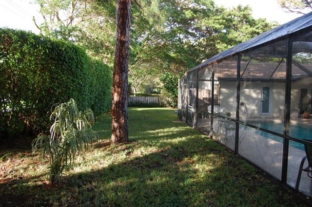 2899 Northwest 24th Court Boca Raton, FL 33431 - Photo 28 of 31 a view of a backyard with a garden
