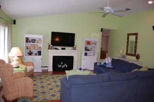 2899 Northwest 24th Court Boca Raton, FL 33431 - Photo 5 of 31 a living room with furniture a flat screen tv and a fireplace