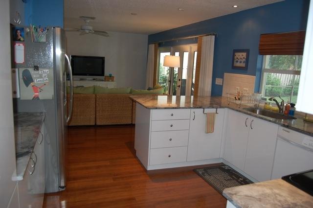 2899 Northwest 24th Court Boca Raton, FL 33431 - Photo 8 of 31 a room with a chair and flat screen tv