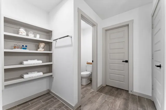 a bathroom with a shower and a glass door