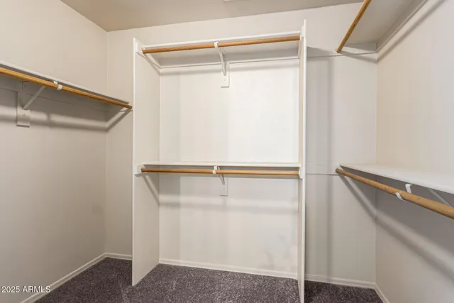 a view of an empty walk in closet