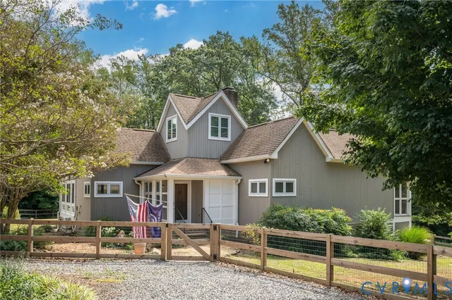 front view of a house with a tree