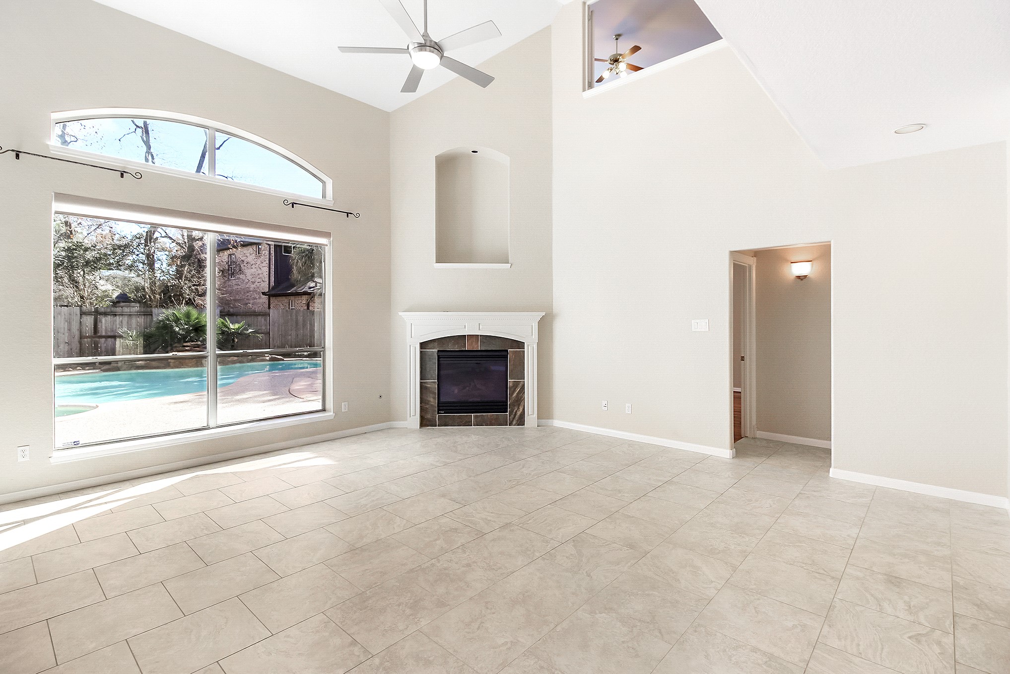 803 Chisel Point Drive Houston, TX 77094 - Photo 11 of 36 Another view of the family room with a wall a wall of windows looking out into the backyard.