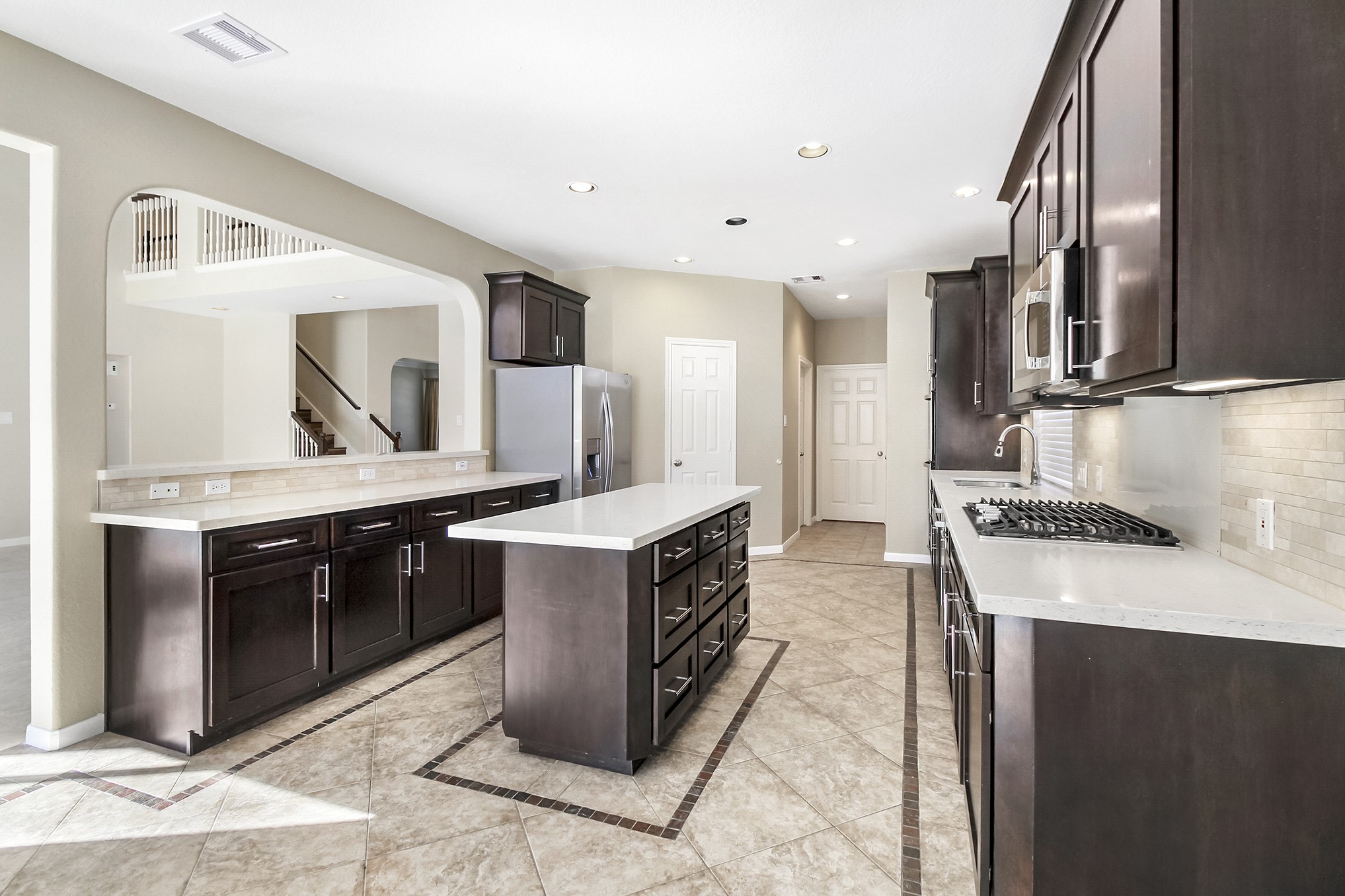 803 Chisel Point Drive Houston, TX 77094 - Photo 14 of 36 a large kitchen with stainless steel appliances granite countertop a sink and a stove
