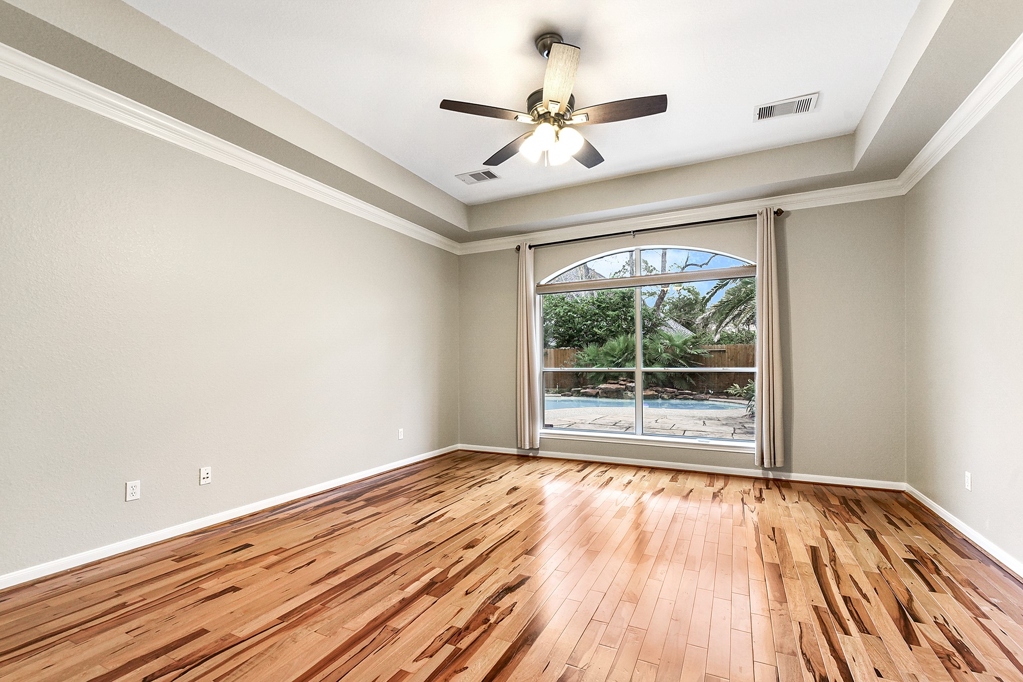 803 Chisel Point Drive Houston, TX 77094 - Photo 21 of 36 a view of an empty room with wooden floor and a window