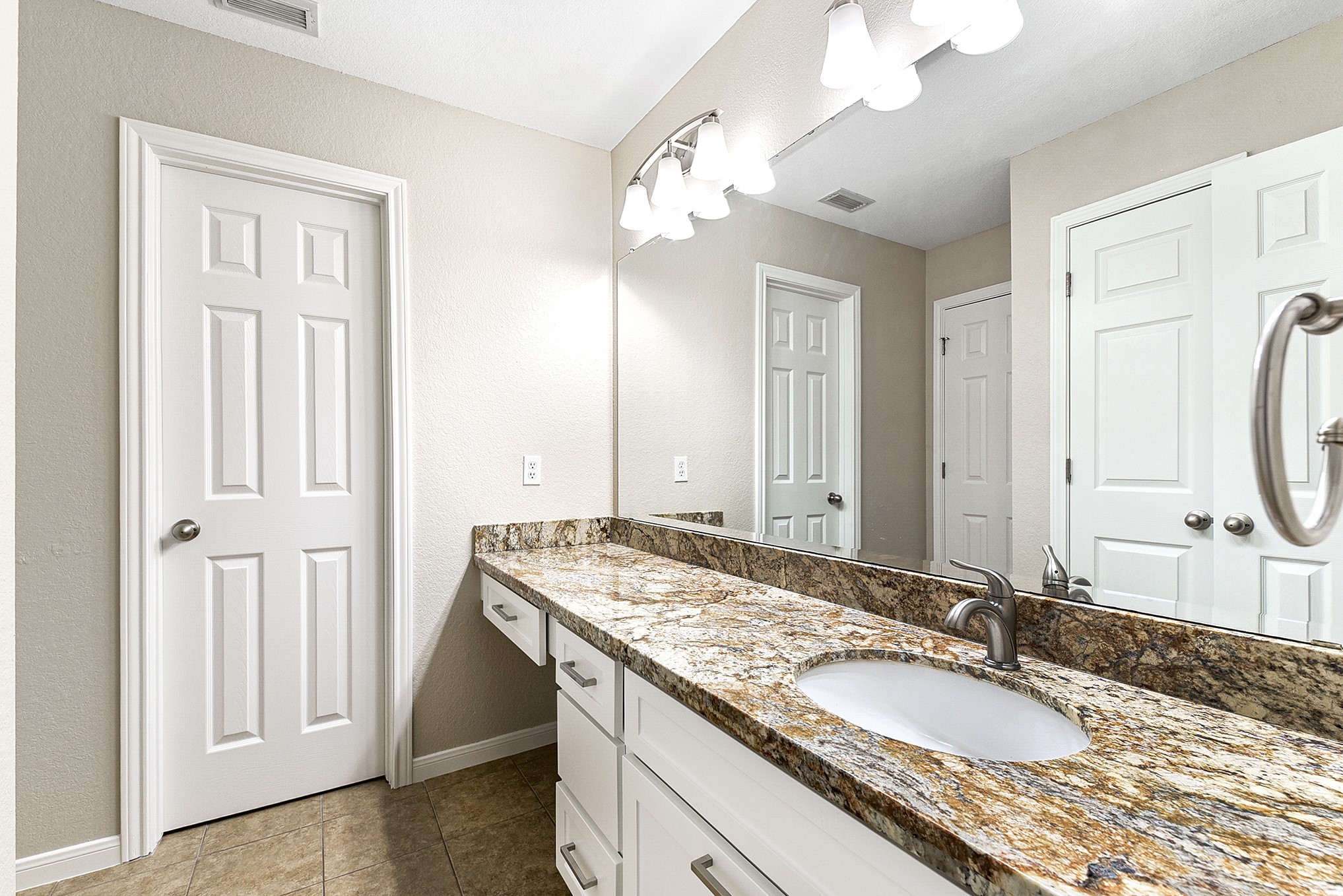 803 Chisel Point Drive Houston, TX 77094 - Photo 29 of 36 a bathroom with a granite countertop double vanity sink and a mirror
