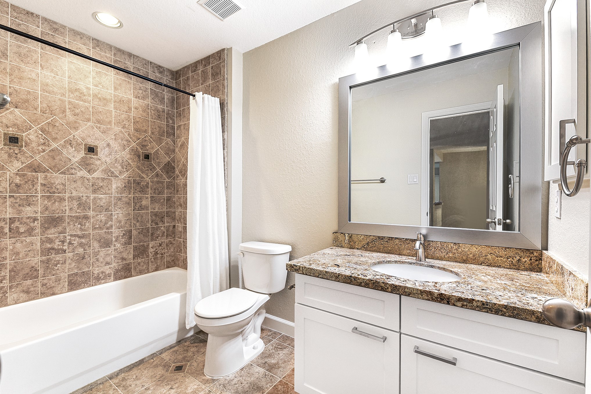 803 Chisel Point Drive Houston, TX 77094 - Photo 31 of 36 a bathroom with a granite countertop sink a toilet and a bathtub