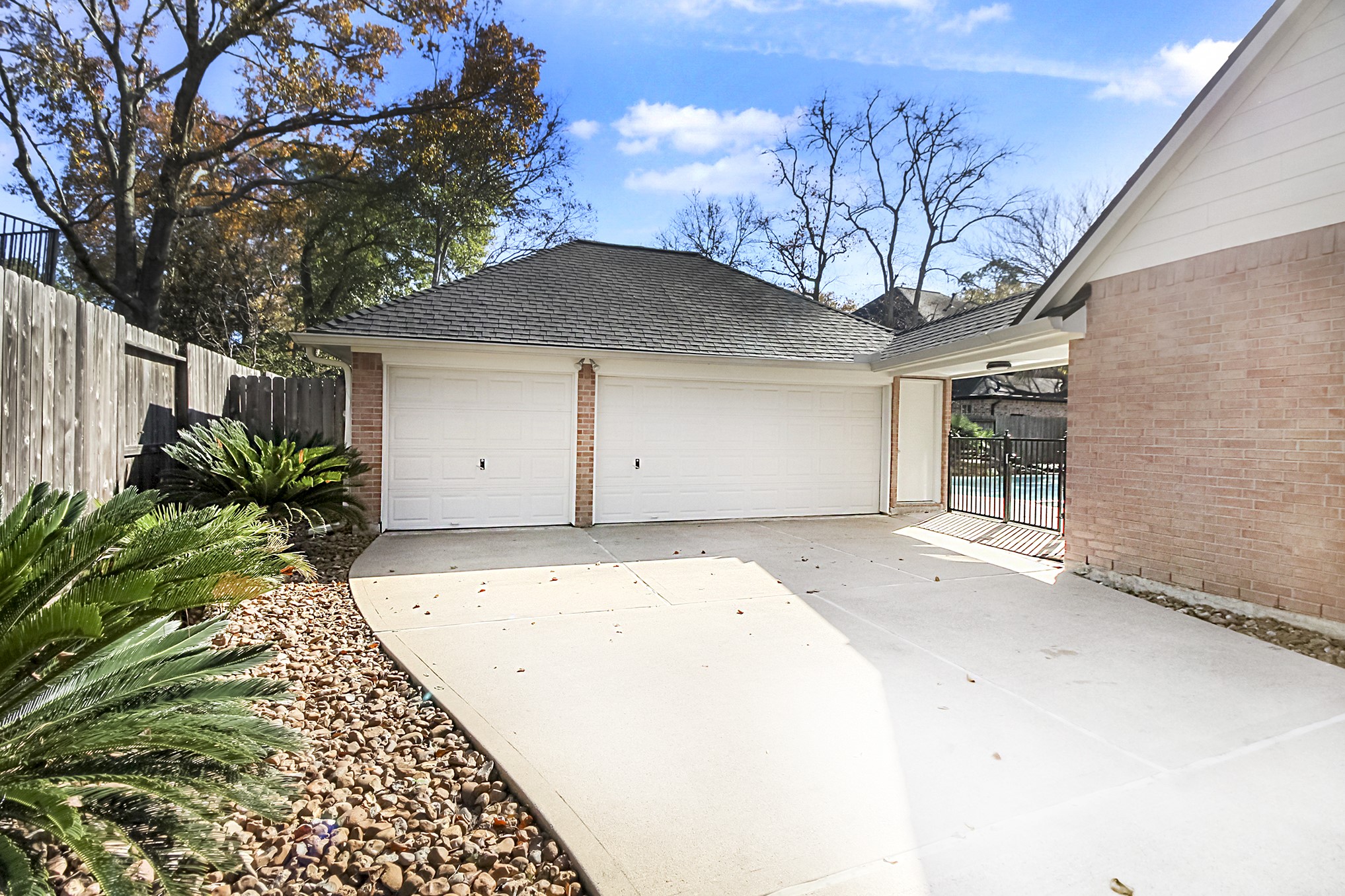 803 Chisel Point Drive Houston, TX 77094 - Photo 35 of 36 Three car garage, at the end of the driveway is an automatic gate.