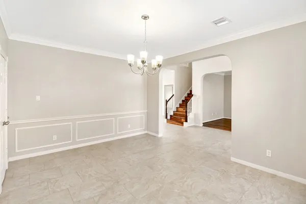 a kitchen with stainless steel appliances granite countertop a stove a sink dishwasher a refrigerator and a microwave oven