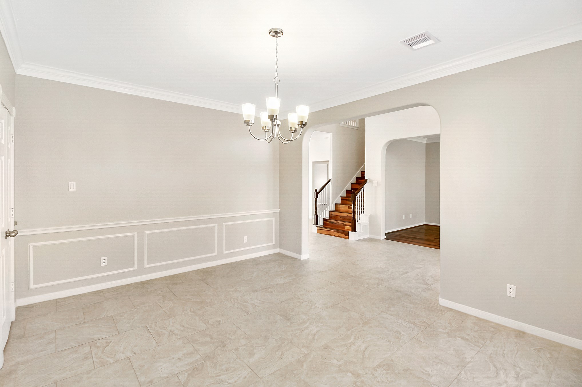 803 Chisel Point Drive Houston, TX 77094 - Photo 7 of 36 Another view of the formal dining room with a contemporary light fixture & crown molding.