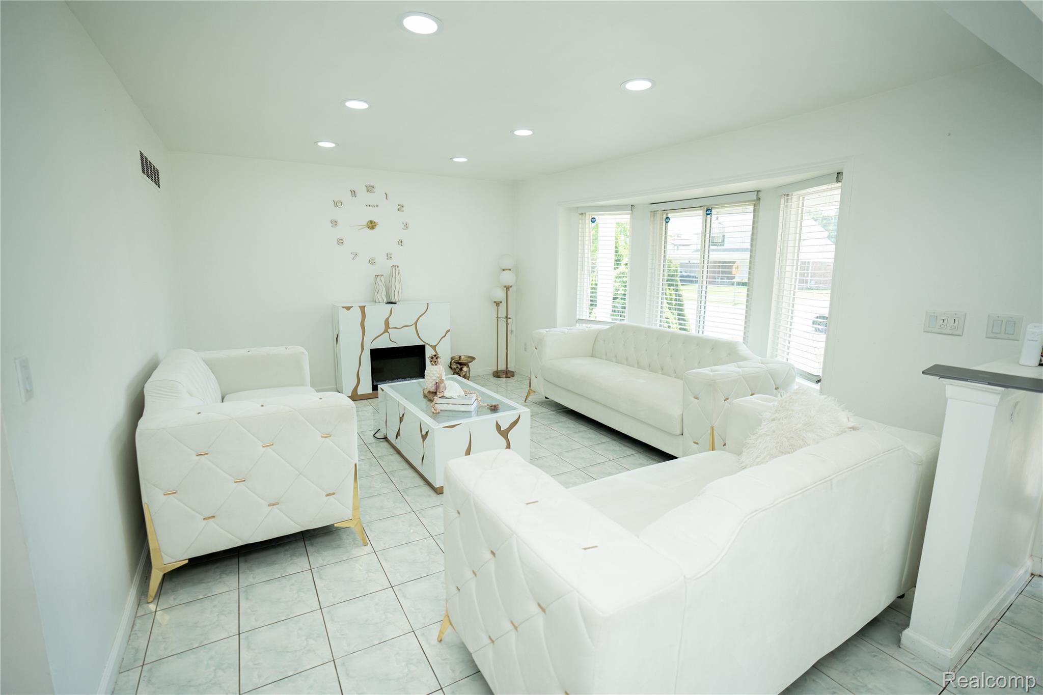 3131 Elmcrest Road Sterling Heights, MI 48310 - Photo 3 of 46 Living area featuring recessed lighting, a premium fireplace, and light tile patterned flooring