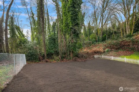 a view of a house with a tree
