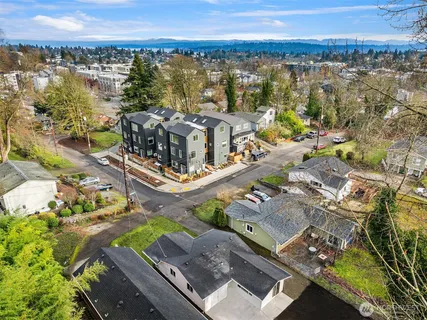 an aerial view of residential house with outdoor space and swimming pool