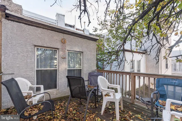 a view of a chair and table in the balcony