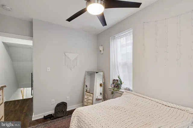 a bathroom with a sink vanity mirror and toilet