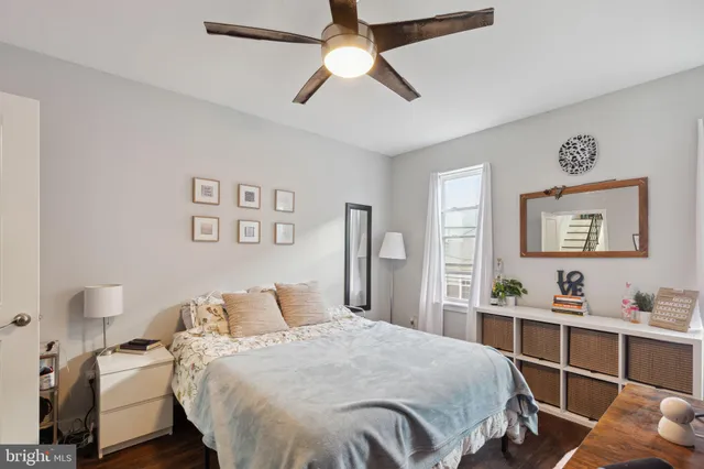 a bedroom with a bed and a dresser