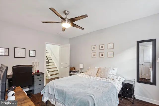 a bedroom with bed and cupboard