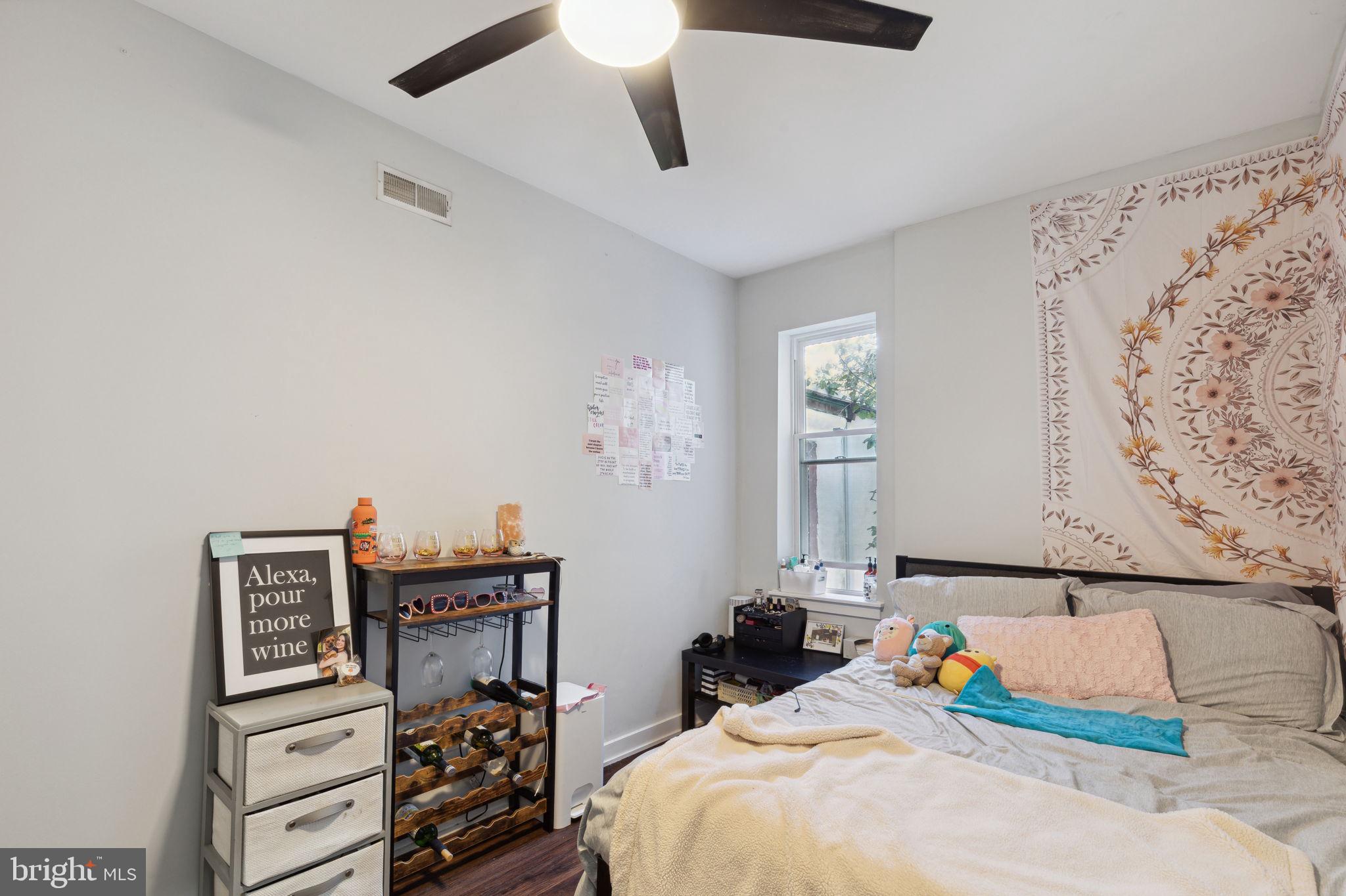 1715 Monument Street Philadelphia, PA 19121 - Photo 22 of 30 a bedroom with bed and cupboard