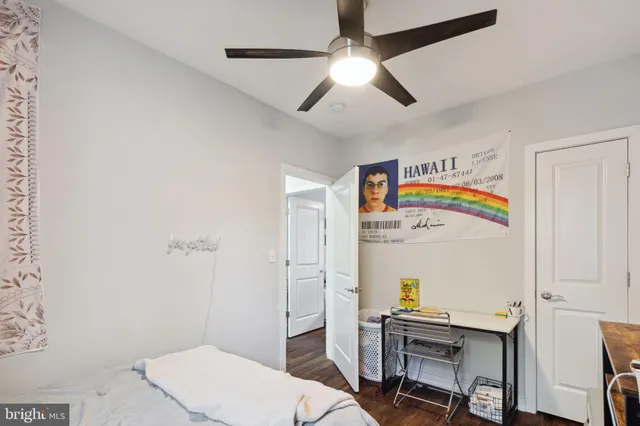 a bedroom that has a bed and a chandelier