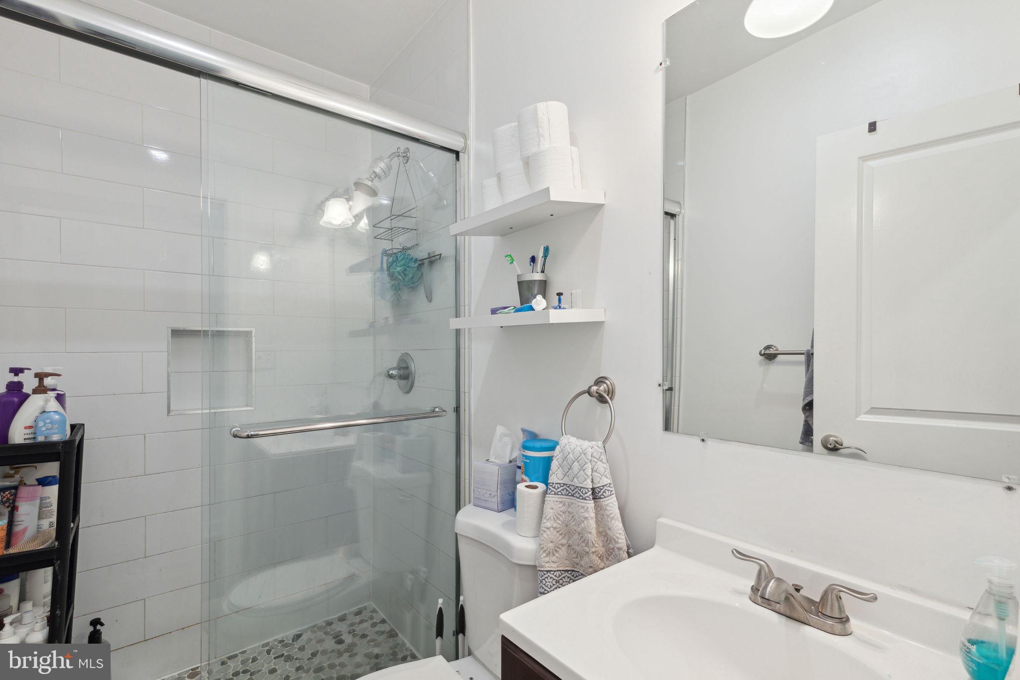 1715 Monument Street Philadelphia, PA 19121 - Photo 26 of 30 a bathroom with a sink and a mirror