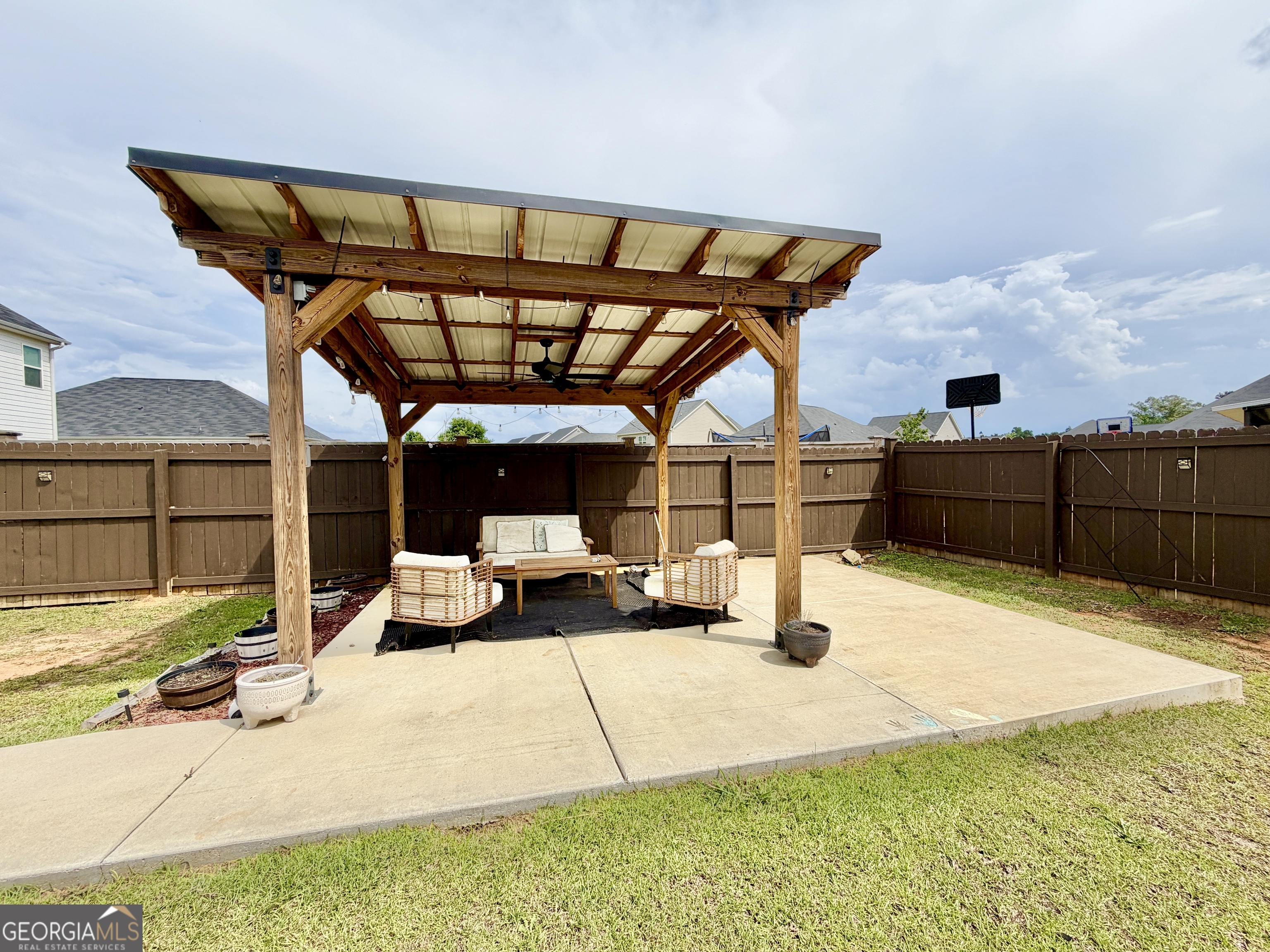 219 Barnyard Way Perry, GA 31069 - Photo 41 of 44 a view of a couch and table in the patio