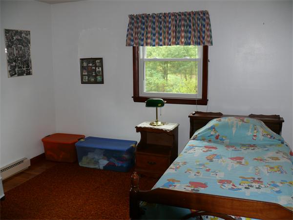 48 Horse Pond Road Shirley, MA 01464 - Photo 11 of 13 a bedroom with furniture and a window