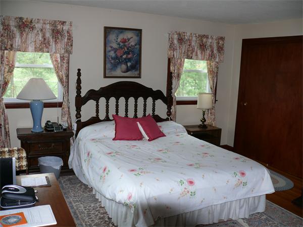 48 Horse Pond Road Shirley, MA 01464 - Photo 12 of 13 a bed sitting in a bedroom next to a window