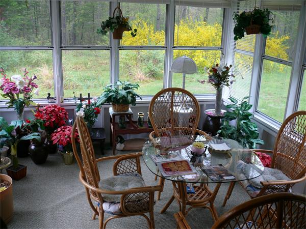 48 Horse Pond Road Shirley, MA 01464 - Photo 13 of 13 a view of a dining room with furniture water view and a potted plants