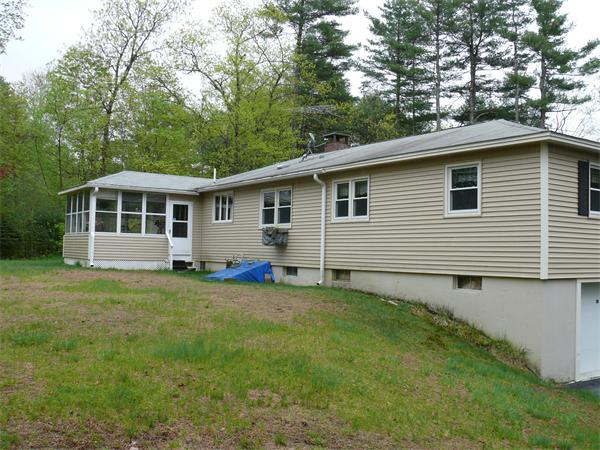 48 Horse Pond Road Shirley, MA 01464 - Photo 3 of 13 a backyard of a house with seating space