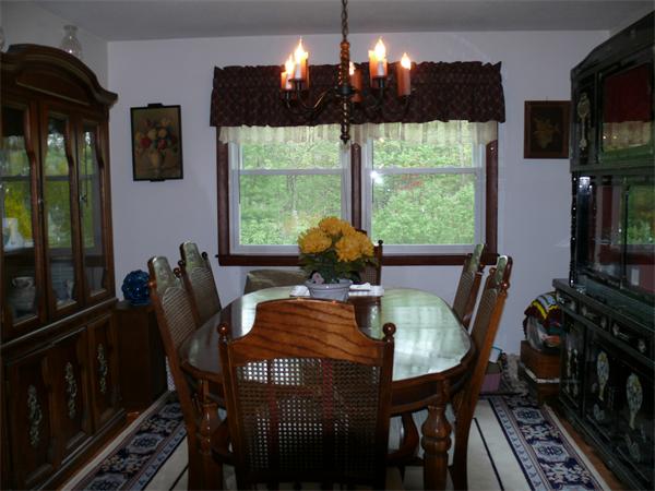 48 Horse Pond Road Shirley, MA 01464 - Photo 8 of 13 a view of a dining room with furniture window and outside view