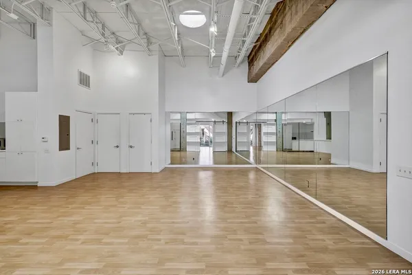 a view of an empty room with windows