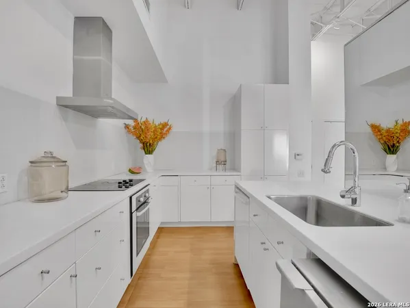 a kitchen with a sink and cabinets