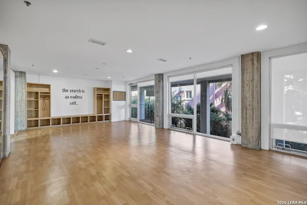a view of an entryway with wooden floor