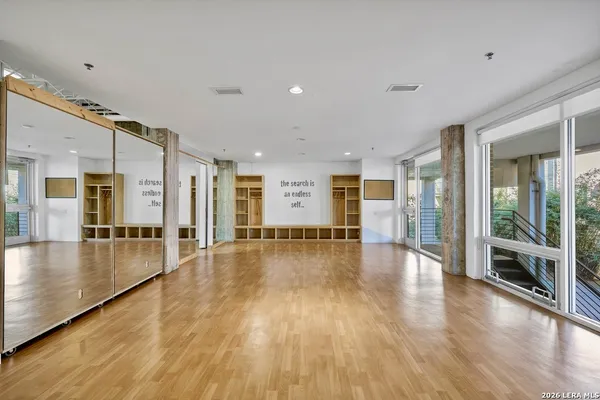 a view of an entryway with wooden floor
