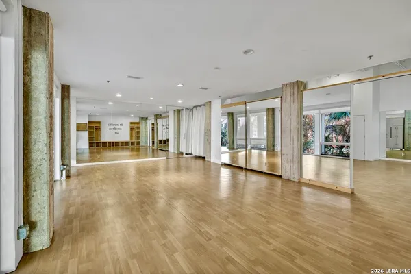 a view of an entryway with wooden floor