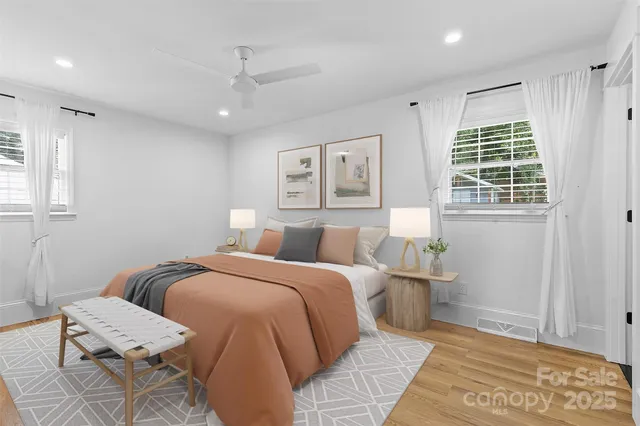 a bed room with a bed and a window