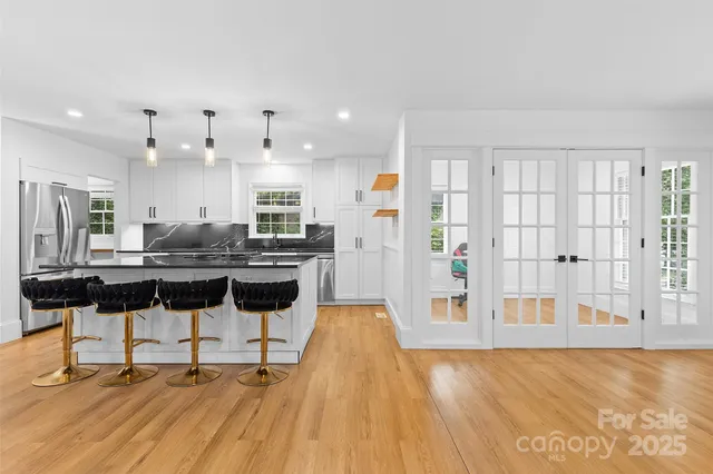 a kitchen with a sink cabinets and window