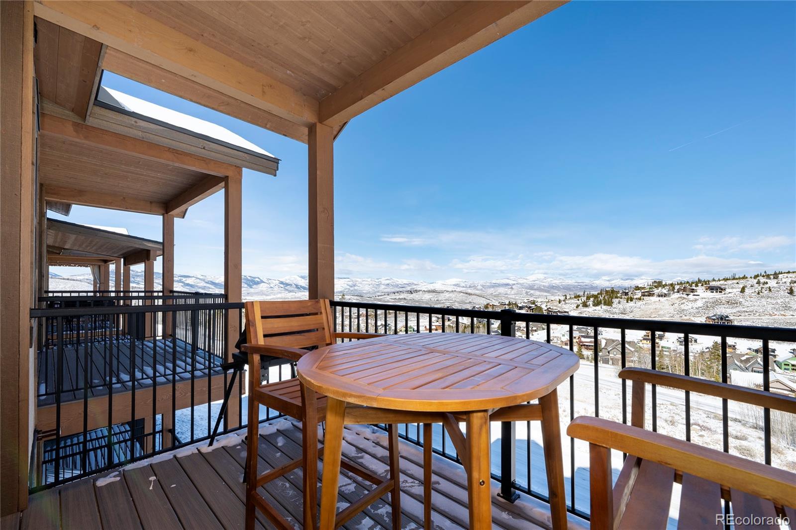 109 Saddle Mountain Camp Road Granby, CO 80446 - Photo 22 of 50 a view of a balcony with a table and chairs