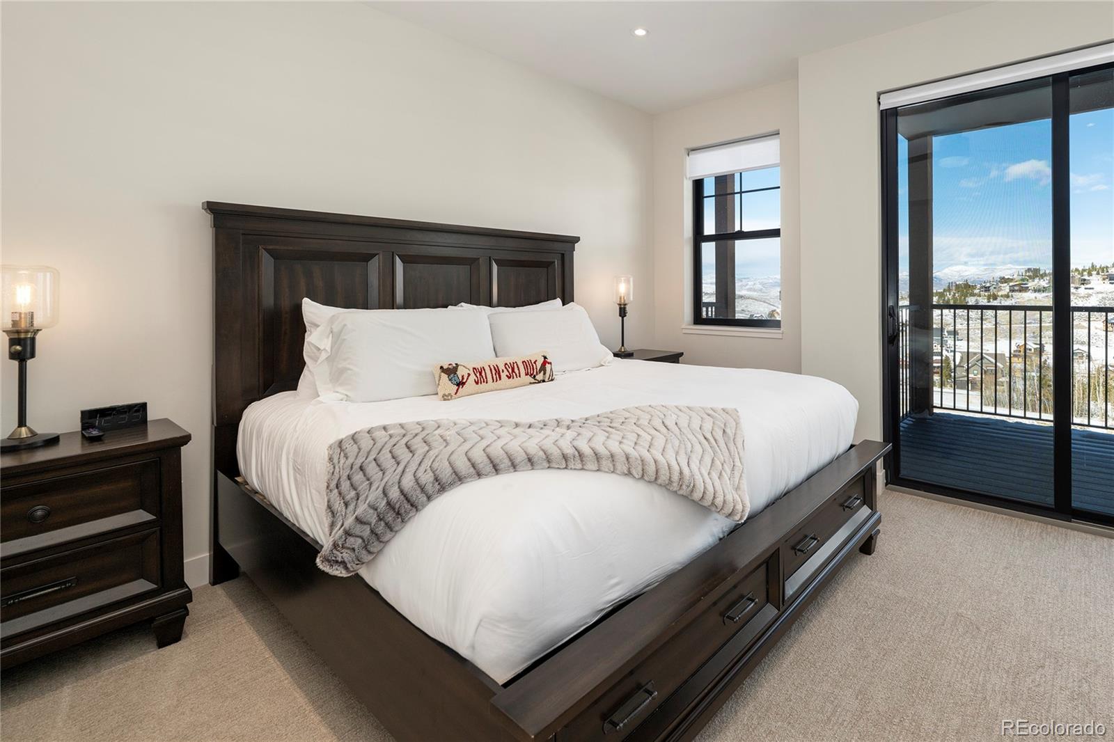 109 Saddle Mountain Camp Road Granby, CO 80446 - Photo 28 of 50 a bedroom with a bed a window and dresser