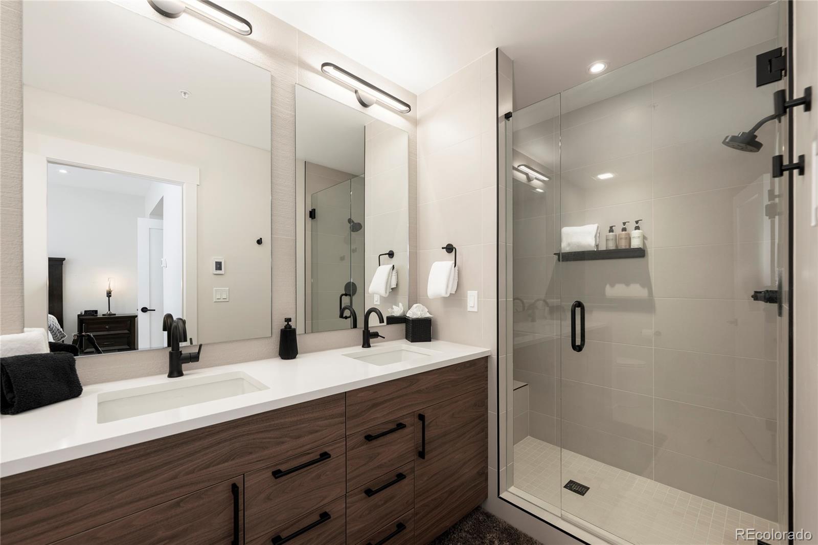 109 Saddle Mountain Camp Road Granby, CO 80446 - Photo 34 of 50 a bathroom with a shower sink and mirror