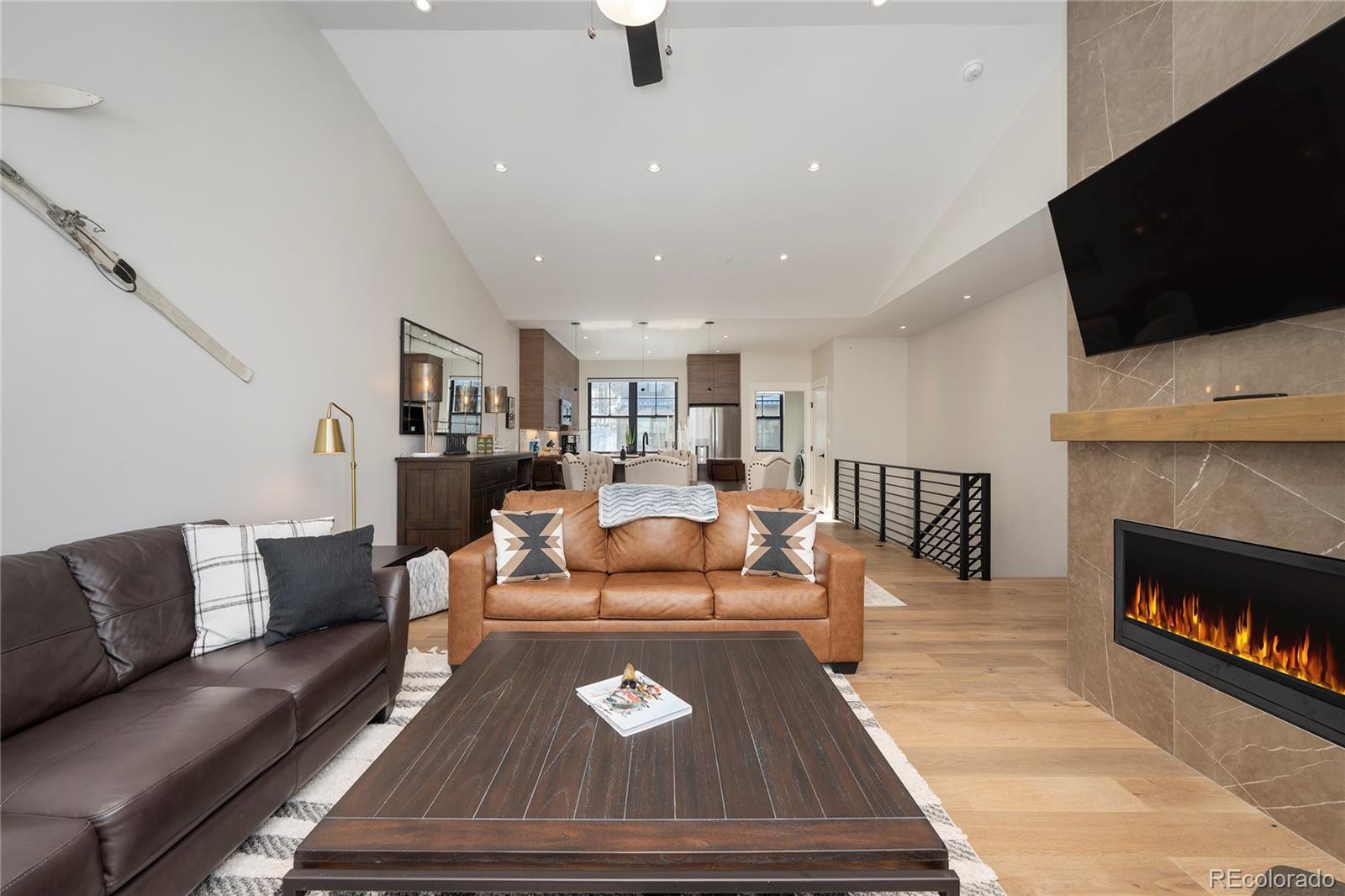 109 Saddle Mountain Camp Road Granby, CO 80446 - Photo 8 of 50 a living room with furniture and a fireplace