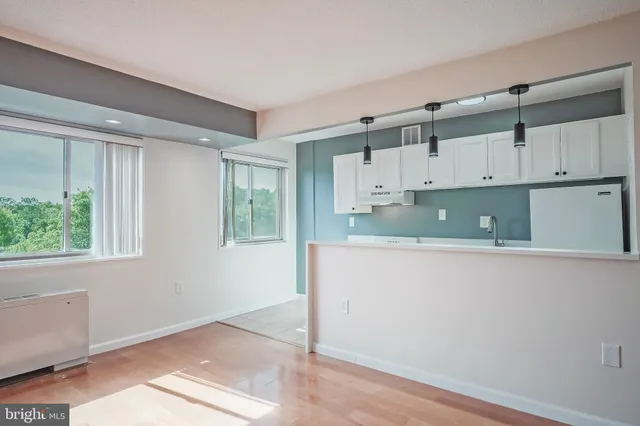 a view of kitchen with wooden floor