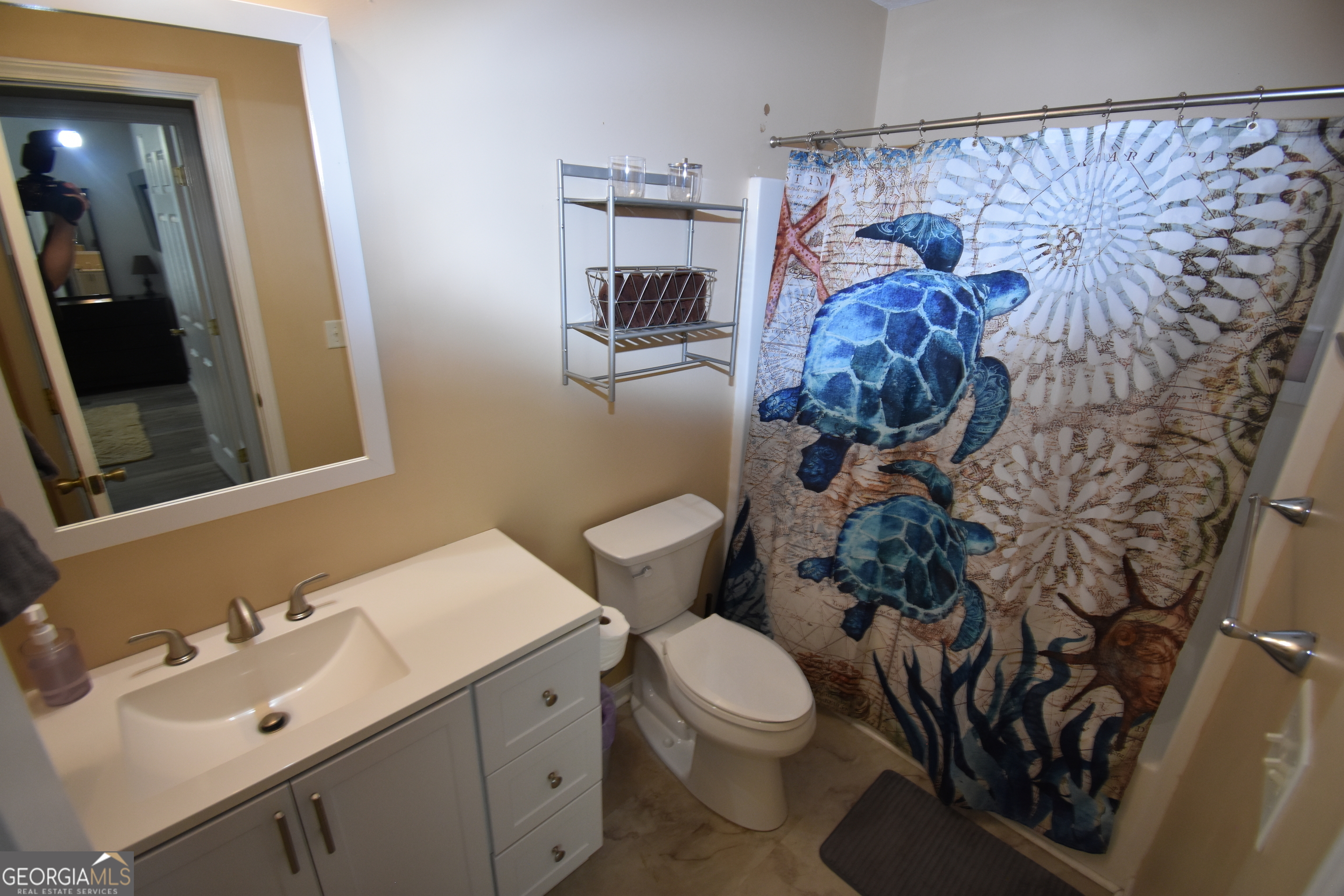 218 Lake Forest Drive Kingsland, GA 31548 - Photo 11 of 17 a bathroom with a toilet sink and mirror